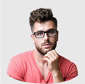 A man with glasses and beard wearing a pink shirt