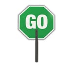 A green stop sign with the word go on it.